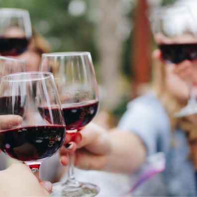 Red wine cheers friends English vineyards English Wine